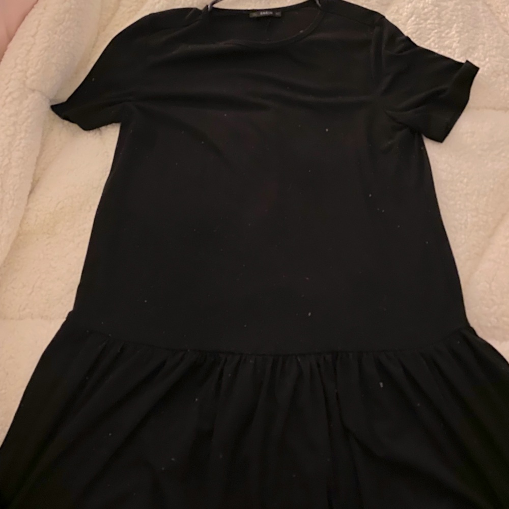 Black dress with ruffle at bottom